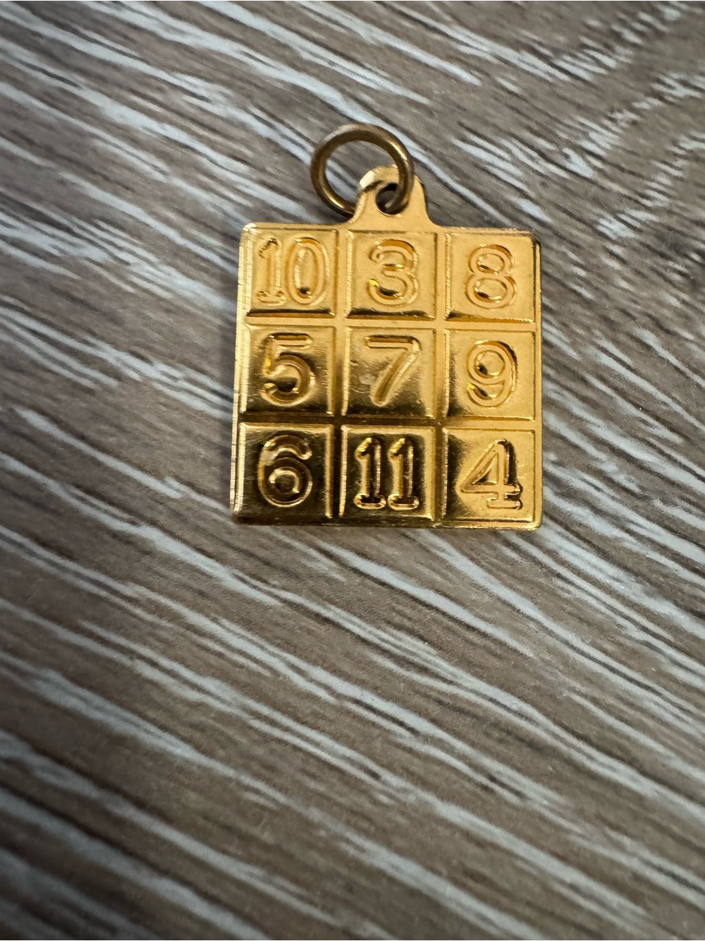 Gold tone magic lucky number square pendant